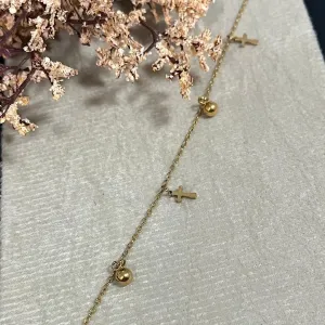 Tornozeleira com pingente cruz no aço dourado