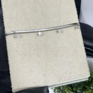 Tornozeleira de aço com pingente estrela
