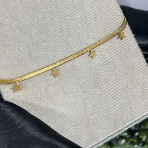 Tornozeleira de aço com pingente estrela