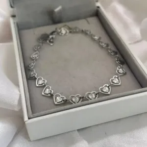 Pulseira coração vazado em aço