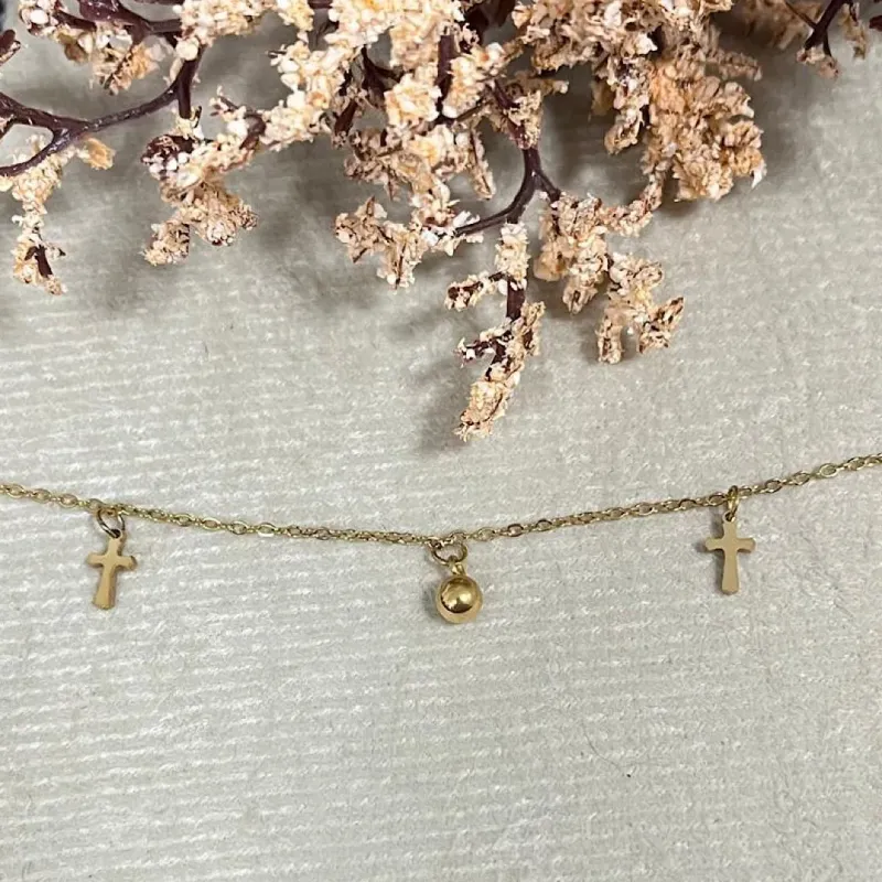 Tornozeleira com pingente cruz no aço dourado