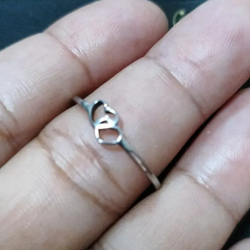 Anel de aço dois corações vazados