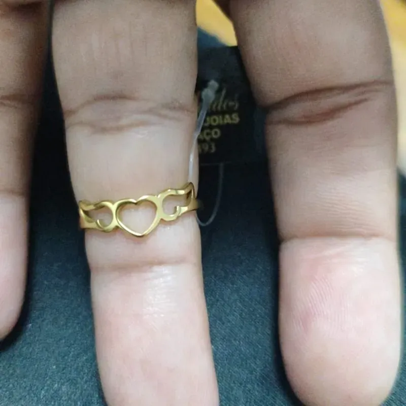 Anel três corações de aço dourado