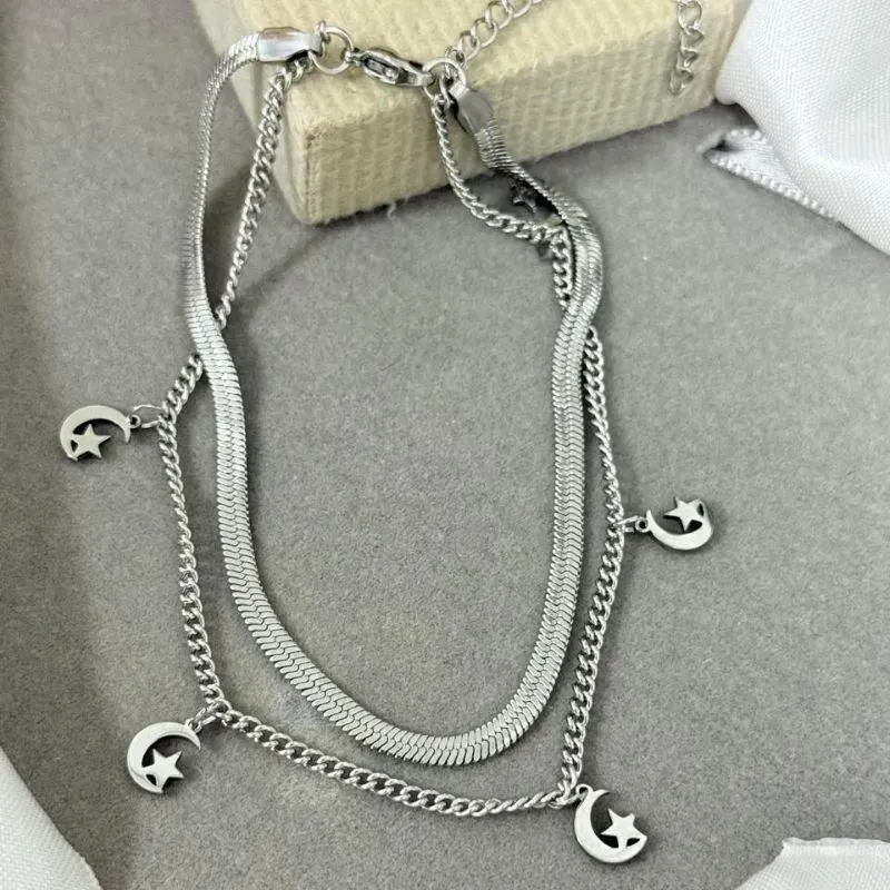 Tornozeleira dupla de aço com pingente