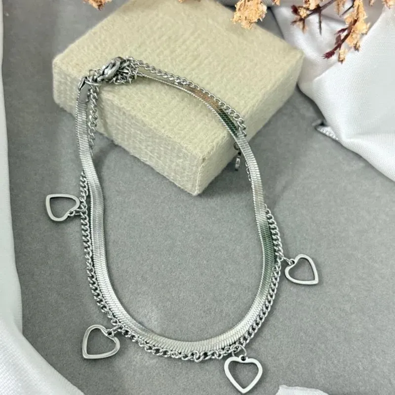 Tornozeleira dupla de aço com pingente coração vazado