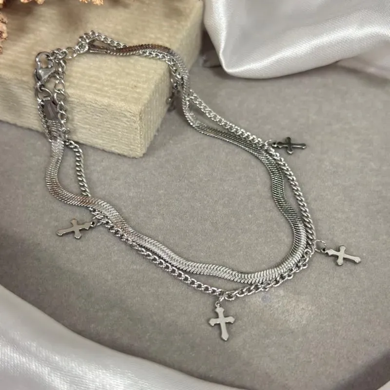 Tornozeleira dupla de aço com pingente cruz