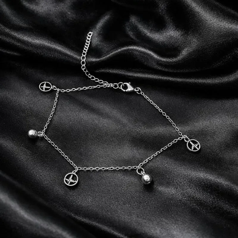 Tornozeleira de aço com pingente