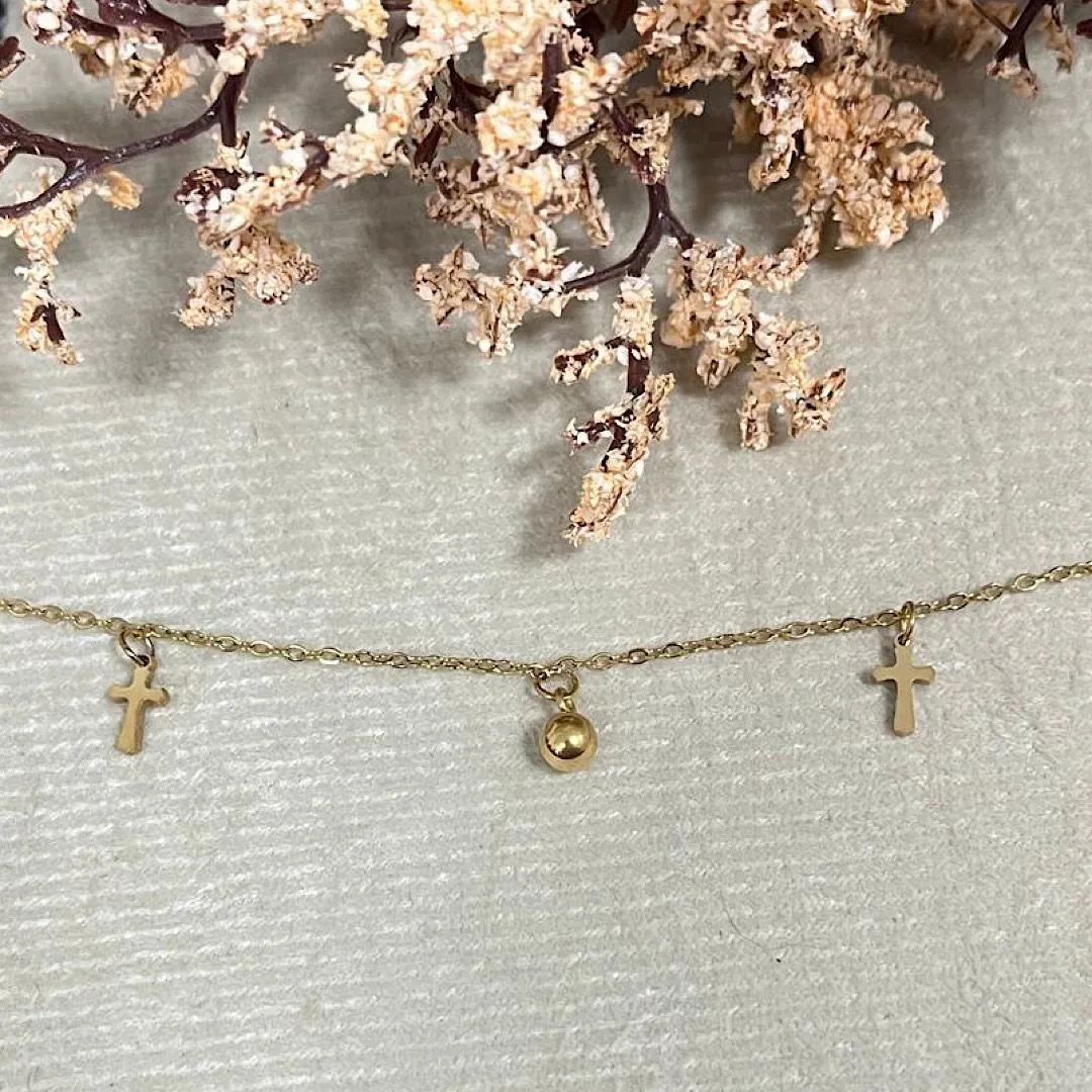 Tornozeleira com pingente cruz no aço dourado