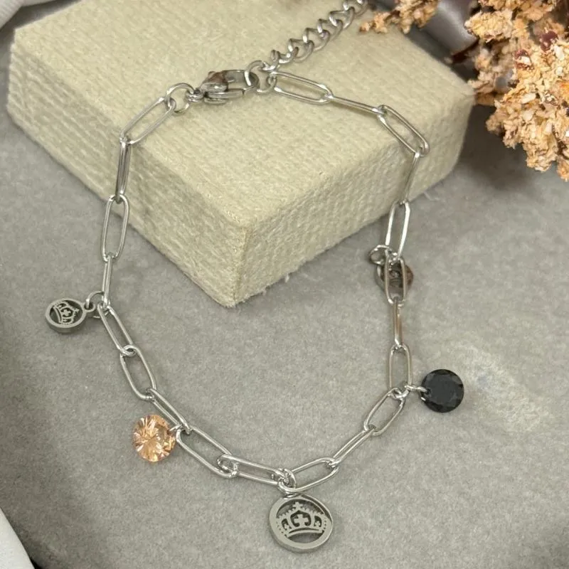Pulseira de aço com pingente de coroa