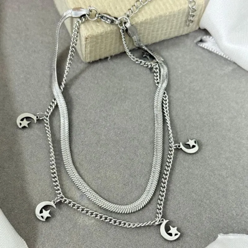 Tornozeleira dupla de aço com pingente