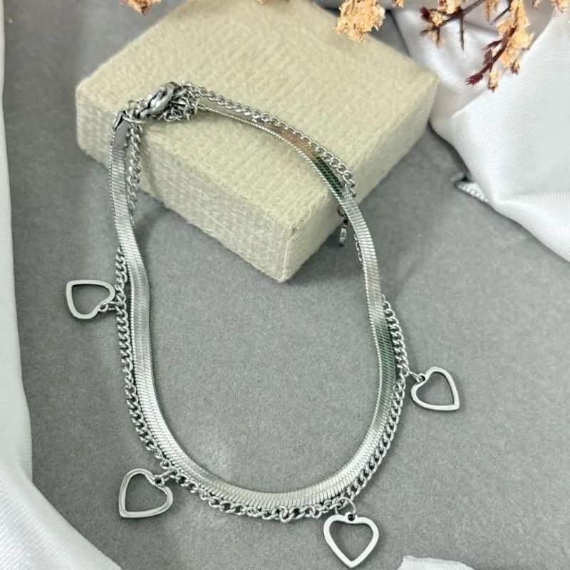 Tornozeleira dupla de aço com pingente coração vazado