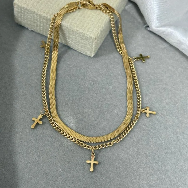 Tornozeleira dupla de aço com pingente cruz