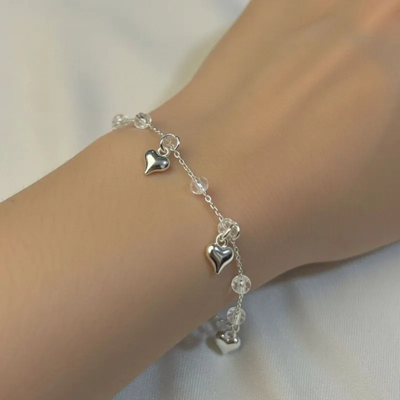 Pulseira com pedras e pingentes